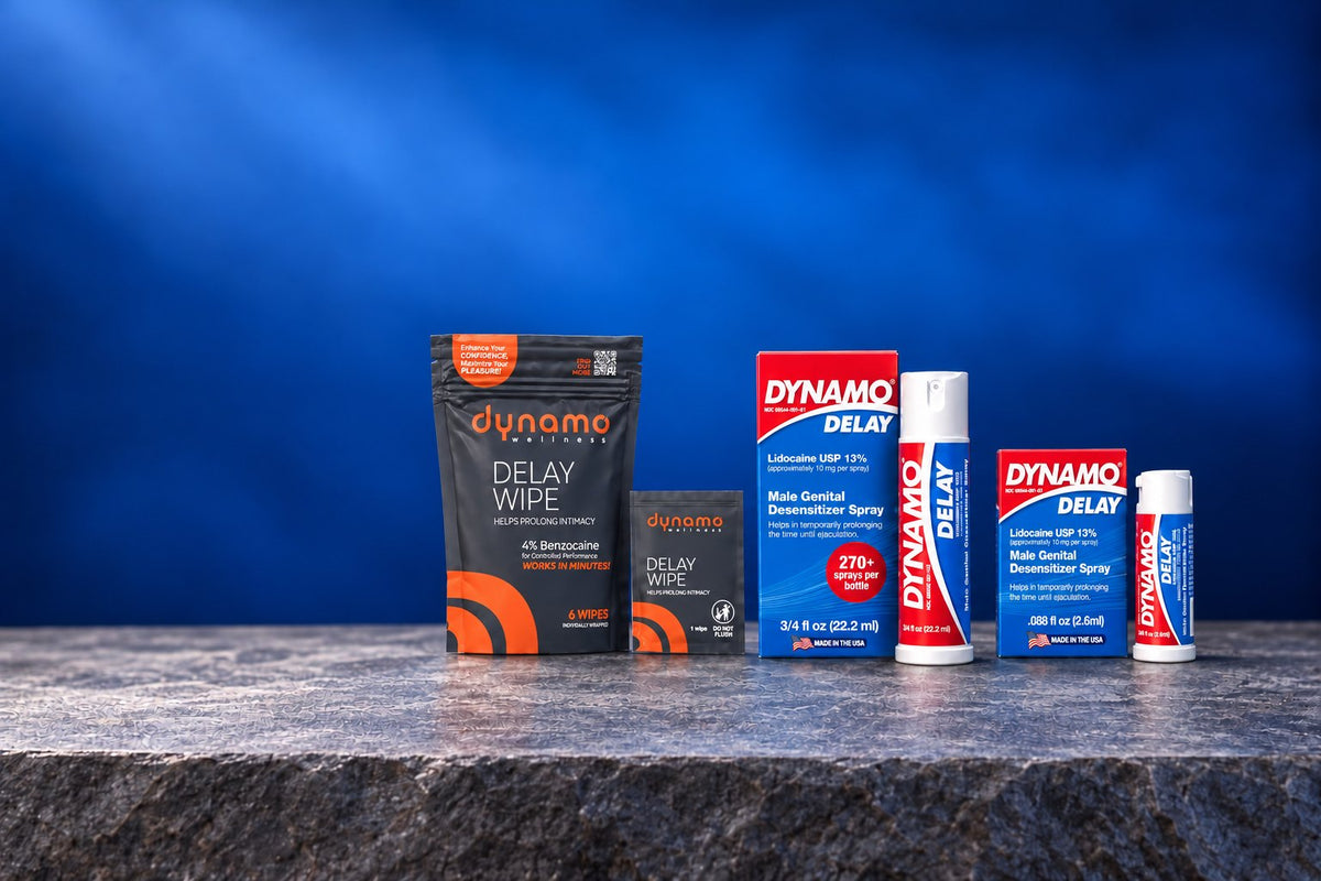 Dynamo Delay spray, To Go and Delay Wipes on a stone ledge against a blue backdrop